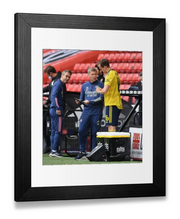 Framed Print : Arsenal's Assistant Coach Steve Round Speaks to Rob Holding during FA Cup Quarterfinal vs Sheffield United Framed Print : Arsenal's Assistant Coach Steve Round Speaks to Rob Holding during FA Cup Quarterfinal vs Sheffield United