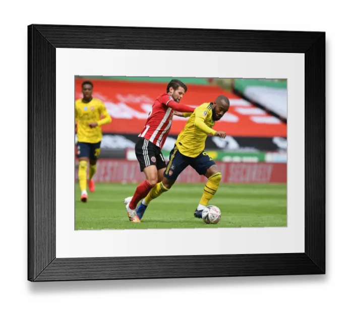 Framed Print : Lacazette vs. Egan: A FA Cup Quarterfinal Battle at Bramall Lane - Arsenal vs. Sheffield United Framed Print : Lacazette vs. Egan: A FA Cup Quarterfinal Battle at Bramall Lane - Arsenal vs. Sheffield United