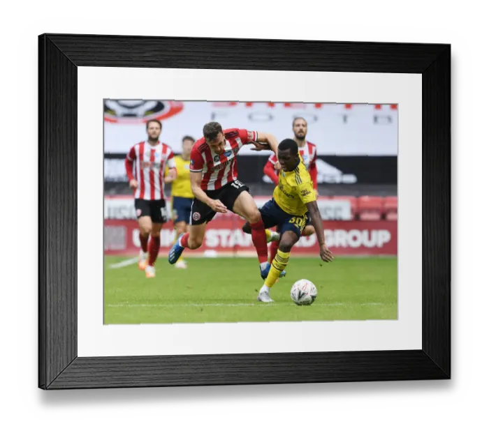 Framed Print : Nketiah vs. Egan: A FA Cup Quarterfinal Showdown - Sheffield United vs. Arsenal