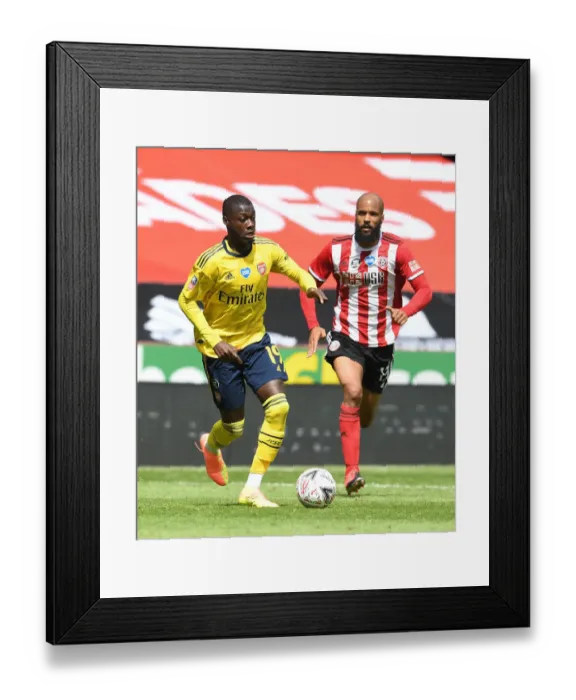 Framed Print : Nicolas Pepe Breaks Past David McGoldrick: Arsenal vs Sheffield United - FA Cup Quarterfinal Showdown Framed Print : Nicolas Pepe Breaks Past David McGoldrick: Arsenal vs Sheffield United - FA Cup Quarterfinal Showdown
