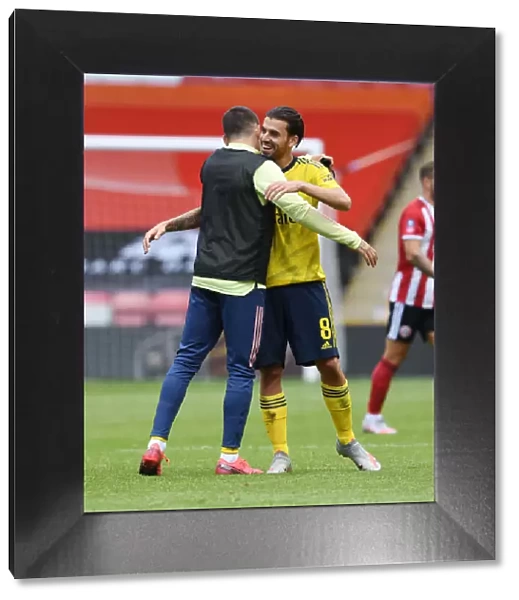 Arsenal Celebrate FA Cup Quarterfinal Victory Over Sheffield United: Dani Ceballos and Hector Bellerin Embrace