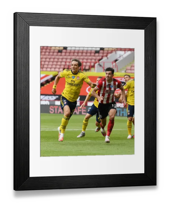 Framed Print : David Luiz vs John Egan: Clash of the Captains in FA Cup Quarterfinal Between Sheffield United and Arsenal