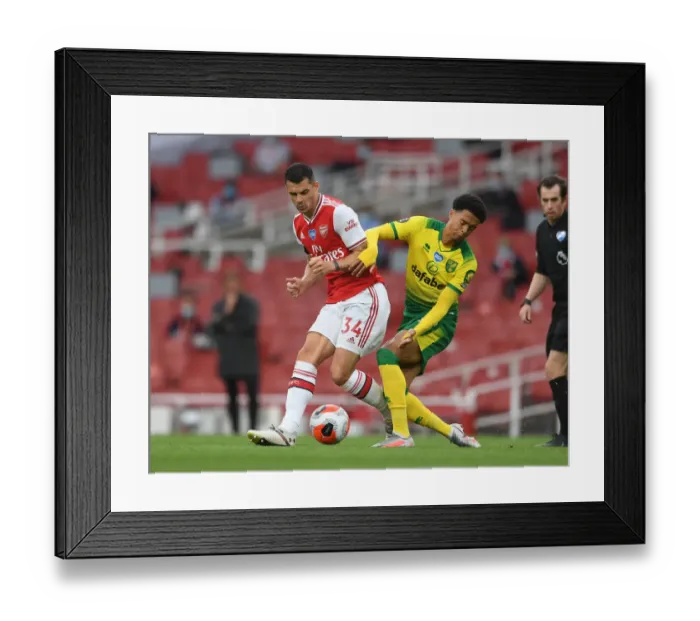 Framed Print : Arsenal vs Norwich: Xhaka Tackles Lewis in Intense Premier League Clash Framed Print : Arsenal vs Norwich: Xhaka Tackles Lewis in Intense Premier League Clash