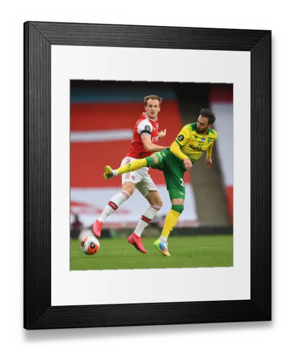 Framed Print : Arsenal vs Norwich: Holding vs Drmic - Premier League Clash at Emirates Stadium