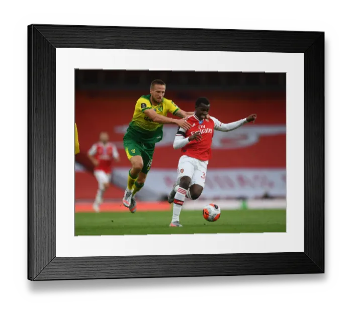 Framed Print : Arsenal vs Norwich: Nketiah Fouls Marco Stiepermann in Premier League Clash at Emirates Stadium
