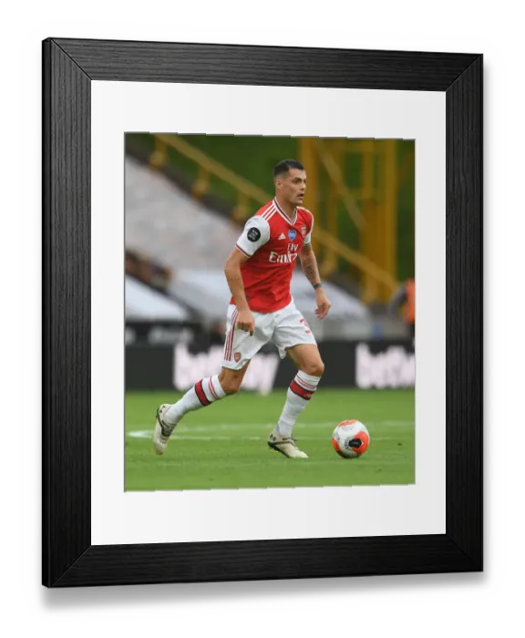Framed Print : Granit Xhaka: Arsenal's Midfield Maestro in Action vs. Wolverhampton Wanderers Framed Print : Granit Xhaka: Arsenal's Midfield Maestro in Action vs. Wolverhampton Wanderers
