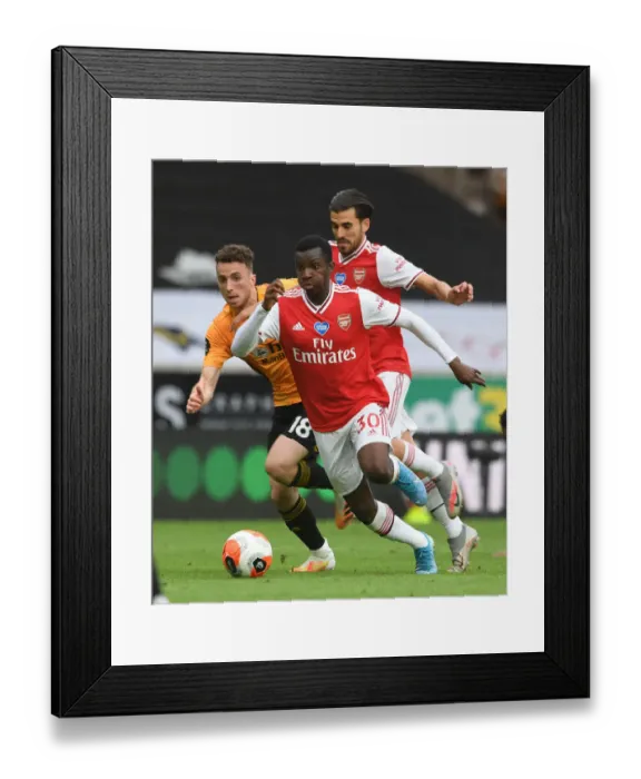 Framed Print : Clash at Molineux: Arsenal's Nketiah and Ceballos Battle Jota of Wolverhampton Framed Print : Clash at Molineux: Arsenal's Nketiah and Ceballos Battle Jota of Wolverhampton