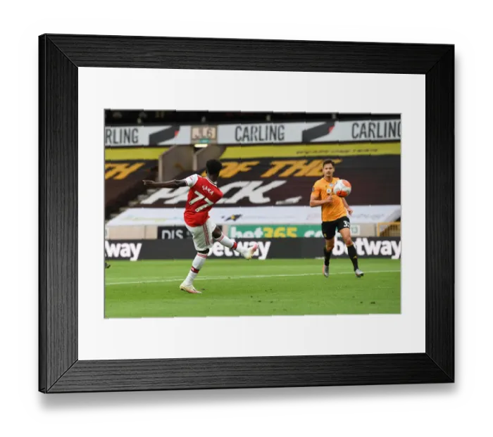 Framed Print : Saka Scores: Arsenal Triumph Over Wolverhampton Wanderers in Premier League Clash (2019-20)
