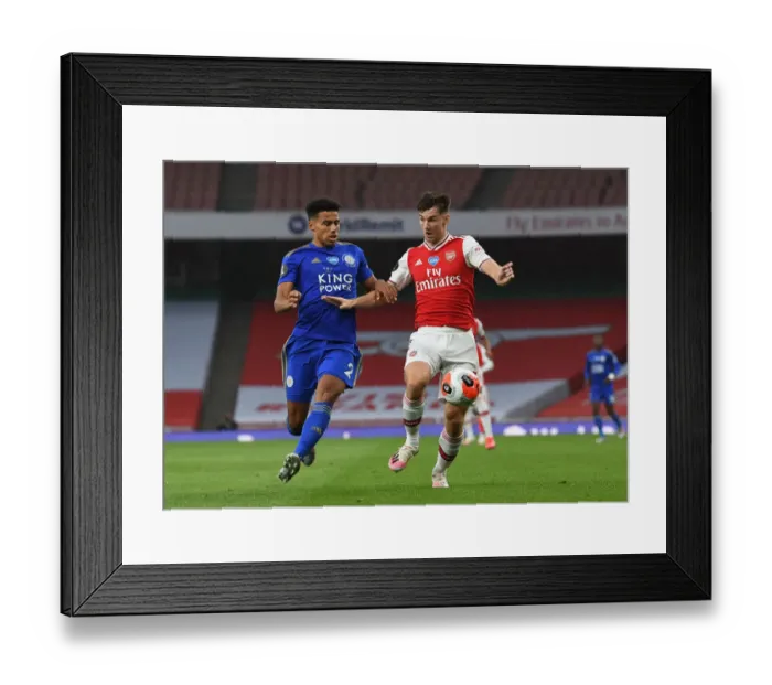Framed Print : Arsenal's Kieran Tierney Clashes with Leicester's James Justin in Premier League Showdown Framed Print : Arsenal's Kieran Tierney Clashes with Leicester's James Justin in Premier League Showdown