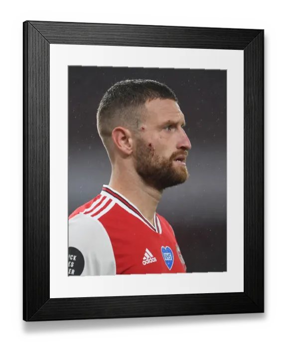 Framed Print : Arsenal's Mustafi Suffers Facial Injury Against Leicester City (2019-20)