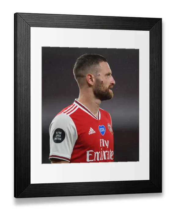 Framed Print : Arsenal's Mustafi Suffers Facial Injury in Arsenal vs. Leicester City Clash (2019-20)