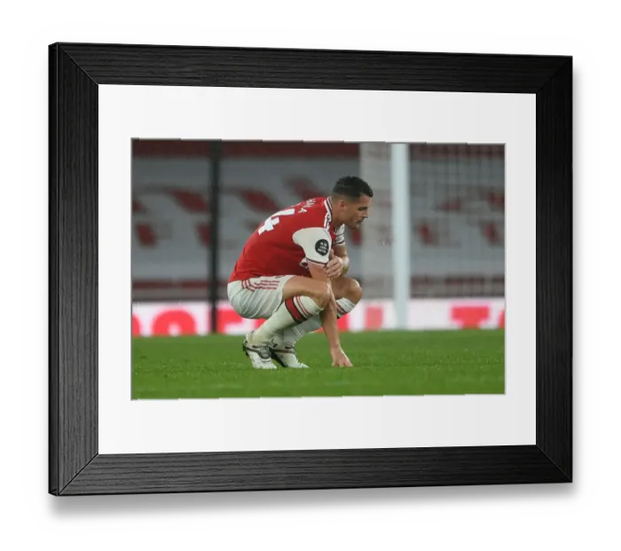 Framed Print : Granit Xhaka: Arsenal's Determined Midfielder Amid Arsenal FC vs Leicester City Premier League Clash (2019-20) Framed Print : Granit Xhaka: Arsenal's Determined Midfielder Amid Arsenal FC vs Leicester City Premier League Clash (2019-20)