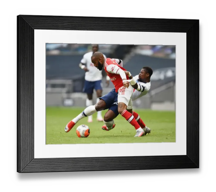 Framed Print : Intense Rivalry: Lacazette Fouls Aurier in Premier League Clash (Tottenham vs. Arsenal, 2019-20)