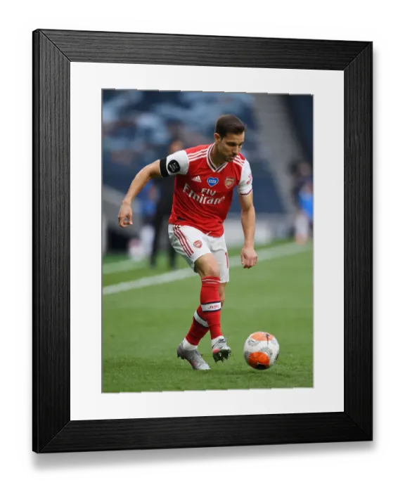 Framed Print : Arsenal's Cedric Faces Off Against Tottenham in Premier League Clash