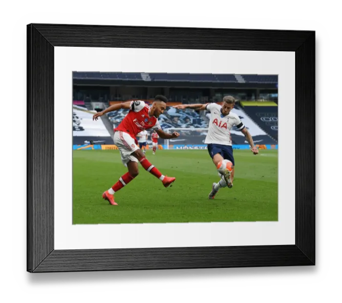 Framed Print : Aubameyang vs Alderweireld: Intense Rivalry in the Premier League Clash Between Tottenham and Arsenal