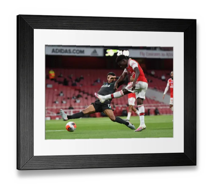 Framed Print : Arsenal's Bukayo Saka Faces Off Against Liverpool's Joe Gomez in Empty Emirates Stadium - Premier League Showdown (Arsenal vs Liverpool, 2019-20)