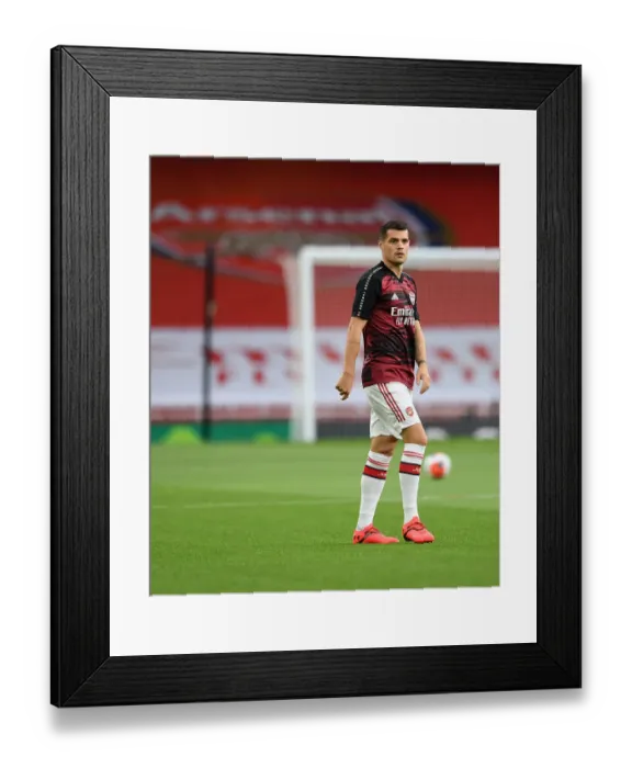 Framed Print : Empty Emirates: Granit Xhaka of Arsenal Prepares for Premier League Clash Against Liverpool Amidst Coronavirus Pandemic Framed Print : Empty Emirates: Granit Xhaka of Arsenal Prepares for Premier League Clash Against Liverpool Amidst Coronavirus Pandemic