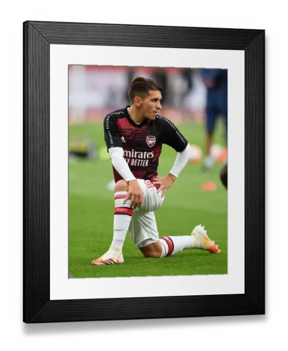 Framed Print : Arsenal's Torreira Warms Up for Empty Arsenal v Liverpool Clash (2019-20)
