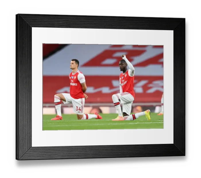 Framed Print : Arsenal's Pepe Takes a Knee at Empty Emirates: Arsenal FC vs Liverpool FC, Premier League 2019-2020