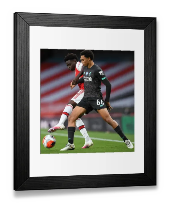 Framed Print : Empty Stadium Showdown: Bukayo Saka vs. Trent Alexander-Arnold - Arsenal vs. Liverpool, 2019-2020: A Riveting Rivalry Amidst an Empty Emirates Stadium Framed Print : Empty Stadium Showdown: Bukayo Saka vs. Trent Alexander-Arnold - Arsenal vs. Liverpool, 2019-2020: A Riveting Rivalry Amidst an Empty Emirates Stadium
