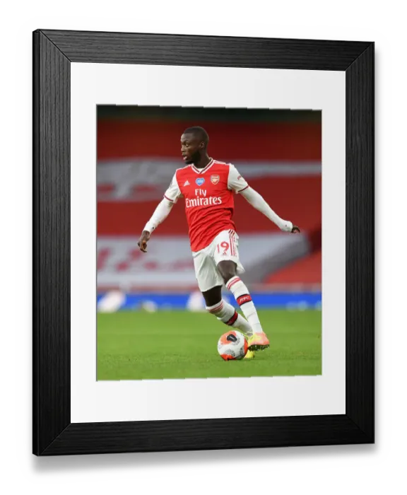 Framed Print : Arsenal's Nicolas Pepe Faces Empty Emirates Stadium in Arsenal vs. Liverpool (2019-20)