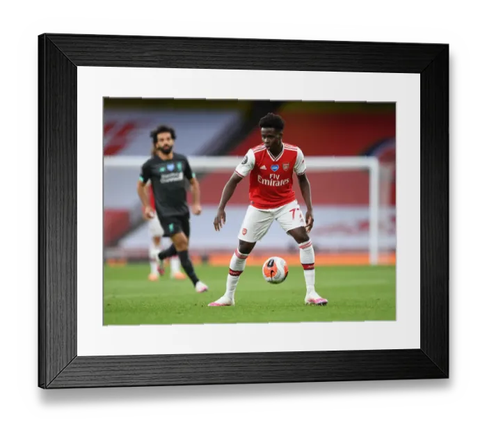 Framed Print : Empty Emirates: Bukayo Saka's Lone Glory in Arsenal's Premier League Clash against Liverpool (2019-2020)
