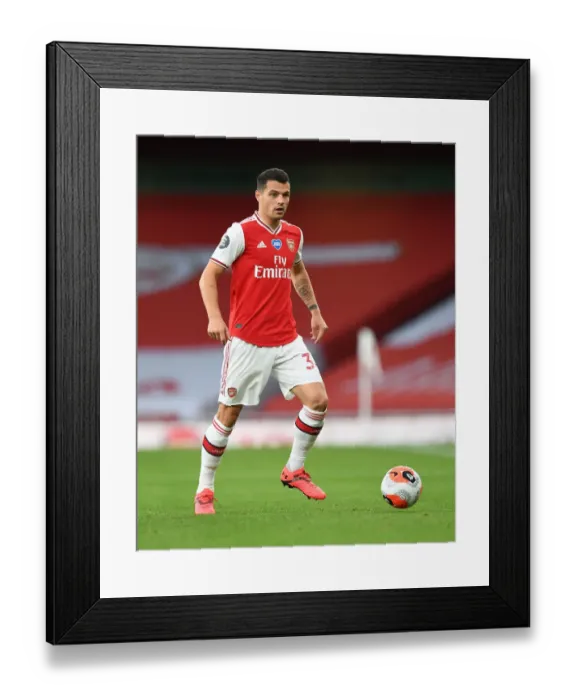 Framed Print : Arsenal's Granit Xhaka in Empty Emirates Stadium: Arsenal FC vs Liverpool FC, Premier League 2019-2020 Framed Print : Arsenal's Granit Xhaka in Empty Emirates Stadium: Arsenal FC vs Liverpool FC, Premier League 2019-2020