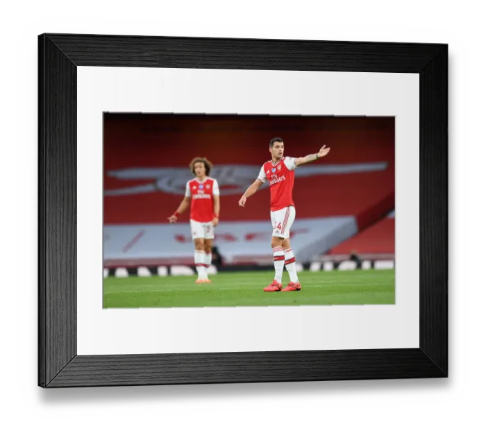 Framed Print : Empty Emirates: Granit Xhaka Faces Liverpool in Ghostly Premier League Arena (2019-2020)