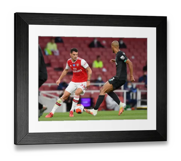 Framed Print : Empty Stadium Showdown: Xhaka vs. Fabinho - Arsenal vs. Liverpool, Premier League 2019-2020 Framed Print : Empty Stadium Showdown: Xhaka vs. Fabinho - Arsenal vs. Liverpool, Premier League 2019-2020