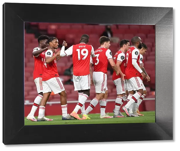 Arsenal's Nelson and Pepe Celebrate Goals in Empty Emirates Stadium: Arsenal vs. Liverpool, Premier League 2019-2020