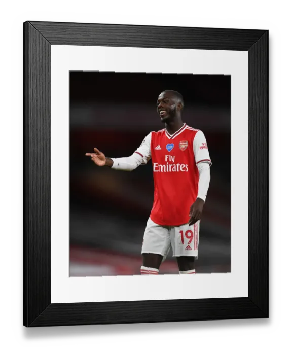 Framed Print : Arsenal's Nicolas Pepe Faces Liverpool in Empty Emirates Stadium (Arsenal v Liverpool 2019-20) Framed Print : Arsenal's Nicolas Pepe Faces Liverpool in Empty Emirates Stadium (Arsenal v Liverpool 2019-20)