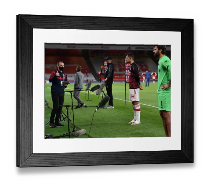 Framed Print : Arsenal's Xhaka Addresses Empty Emirates: Arsenal vs. Liverpool Amidst Coronavirus Pandemic, 2019-2020 Premier League Framed Print : Arsenal's Xhaka Addresses Empty Emirates: Arsenal vs. Liverpool Amidst Coronavirus Pandemic, 2019-2020 Premier League