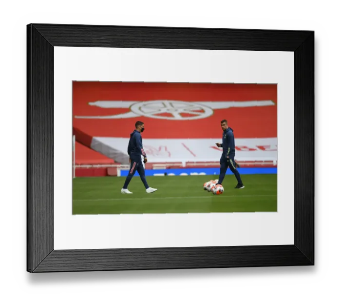 Framed Print : Arsenal's Sokratis Prepares for Empty Arsenal FC vs Liverpool FC Clash (2019-20)