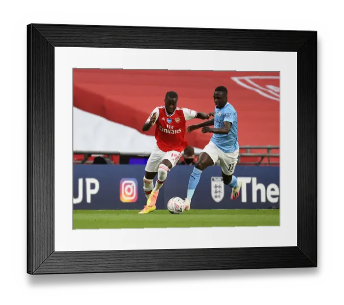 Framed Print : Arsenal's Nicolas Pepe Outmaneuvers Manchester City's Benjamin Mendy in FA Cup Semi-Final Showdown Framed Print : Arsenal's Nicolas Pepe Outmaneuvers Manchester City's Benjamin Mendy in FA Cup Semi-Final Showdown