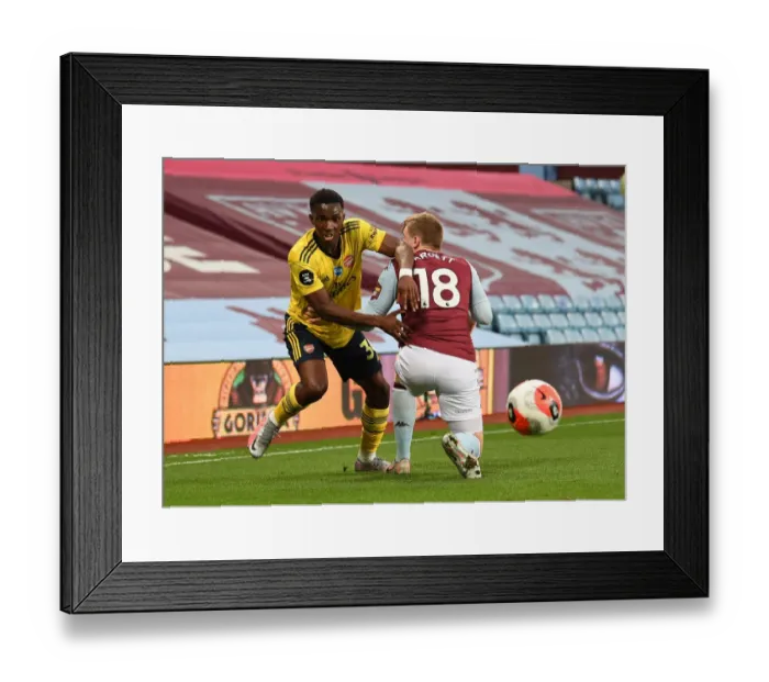 Framed Print : Arsenal's Eddie Nketiah Clashes with Aston Villa's Matt Targett in Premier League Showdown Framed Print : Arsenal's Eddie Nketiah Clashes with Aston Villa's Matt Targett in Premier League Showdown