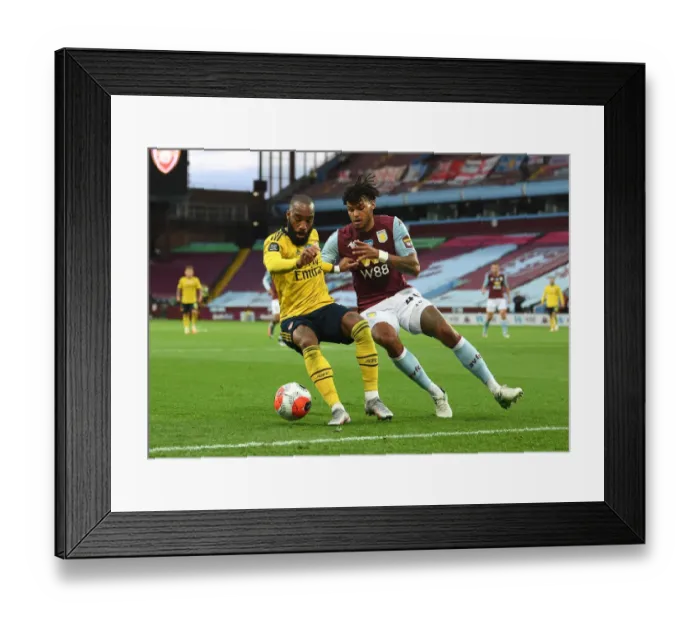 Framed Print : Lacazette vs. Mings: Aston Villa vs. Arsenal FC - Premier League Clash (2019-20)