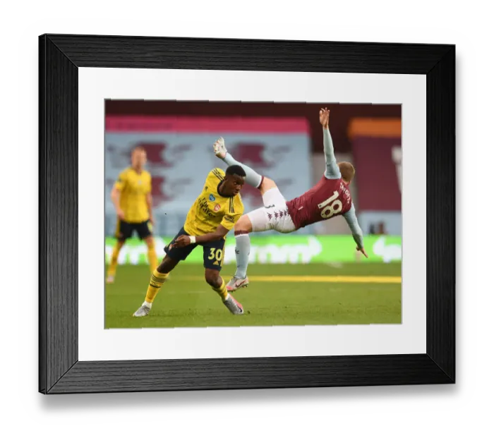Framed Print : Clash at Villa Park: Arsenal's Eddie Nketiah Faces Off Against Aston Villa's Matt Targett Framed Print : Clash at Villa Park: Arsenal's Eddie Nketiah Faces Off Against Aston Villa's Matt Targett
