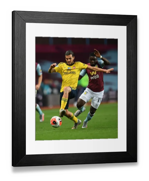 Framed Print : Dani Ceballos vs Marvelous Nakamba: Intense Battle in Aston Villa vs Arsenal FC Premier League Clash