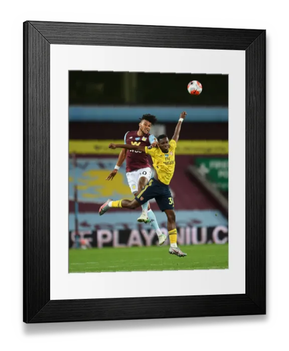 Framed Print : Nketiah vs. Mings: A Premier League Showdown at Villa Park Framed Print : Nketiah vs. Mings: A Premier League Showdown at Villa Park