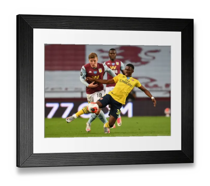 Framed Print : Nketiah vs. Targett: A Premier League Showdown at Villa Park Framed Print : Nketiah vs. Targett: A Premier League Showdown at Villa Park