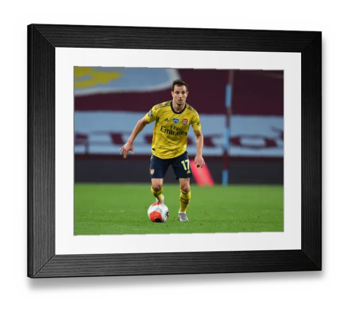 Framed Print : Arsenal's Cedric Faces Off in Intense Showdown Against Aston Villa in Premier League