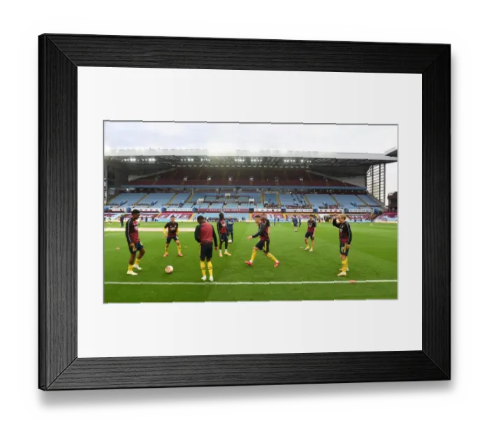 Framed Print : Arsenal's Premier League Showdown at Aston Villa: Warm-Up Moments