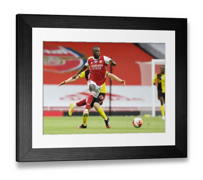 Framed Print : Pepe's Sneaky Moves: Outsmarting Hughes in Arsenal's Premier League Victory Framed Print : Pepe's Sneaky Moves: Outsmarting Hughes in Arsenal's Premier League Victory