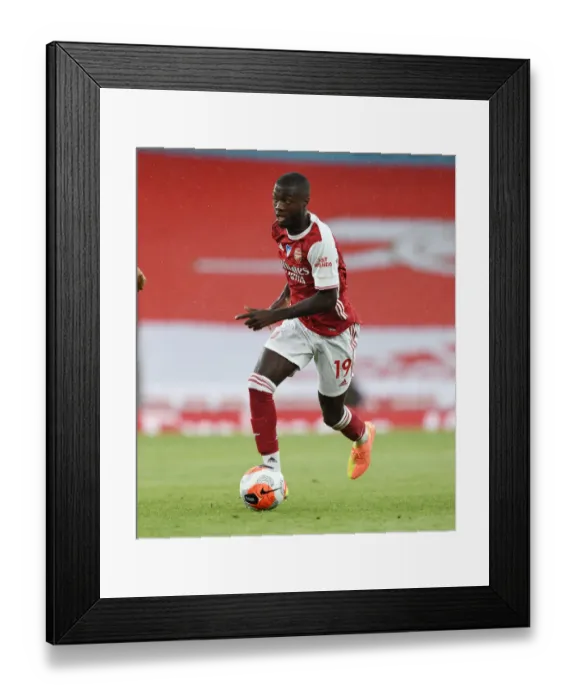 Framed Print : Arsenal's Nicolas Pepe Shines: Arsenal FC Dominates Watford FC in Premier League Clash (2019-20)