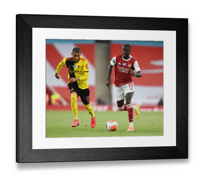 Framed Print : Arsenal's Nicolas Pepe Outmaneuvers Watford's Roberto Pereyra in Premier League Clash Framed Print : Arsenal's Nicolas Pepe Outmaneuvers Watford's Roberto Pereyra in Premier League Clash