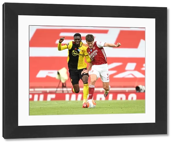 Arsenal's Kieran Tierney Goes Head-to-Head with Ismaila Sarr in Premier League Showdown