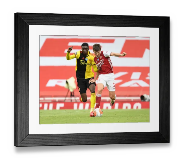Framed Print : Arsenal's Kieran Tierney Goes Head-to-Head with Ismaila Sarr in Premier League Showdown