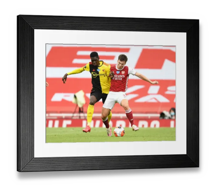 Framed Print : Arsenal's Kieran Tierney Clashes with Ismaila Sarr in Intense Premier League Face-off Framed Print : Arsenal's Kieran Tierney Clashes with Ismaila Sarr in Intense Premier League Face-off