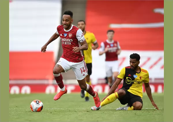Arsenal's Aubameyang Outmaneuvers Watford's Mariappa in Premier League Clash