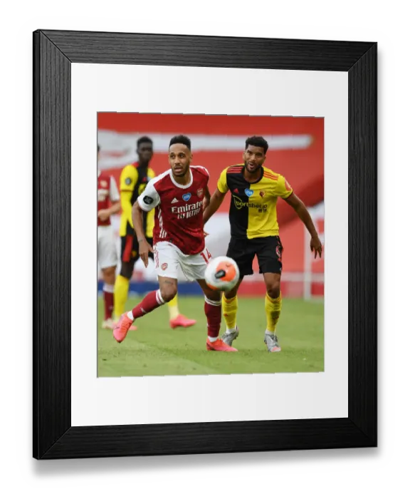 Framed Print : Arsenal's Aubameyang Faces Off Against Watford's Mariappa in Premier League Clash Framed Print : Arsenal's Aubameyang Faces Off Against Watford's Mariappa in Premier League Clash
